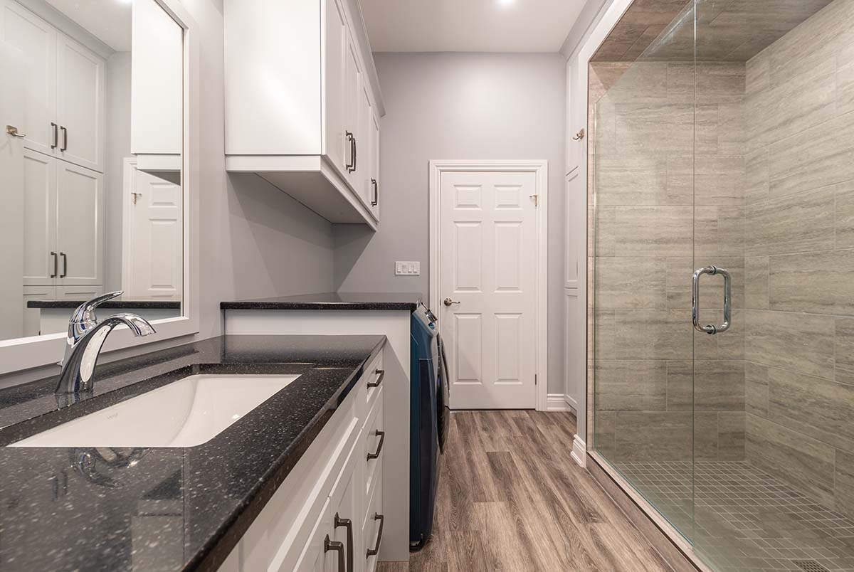 Bathroom and Laundry room area with walk in tiled shower