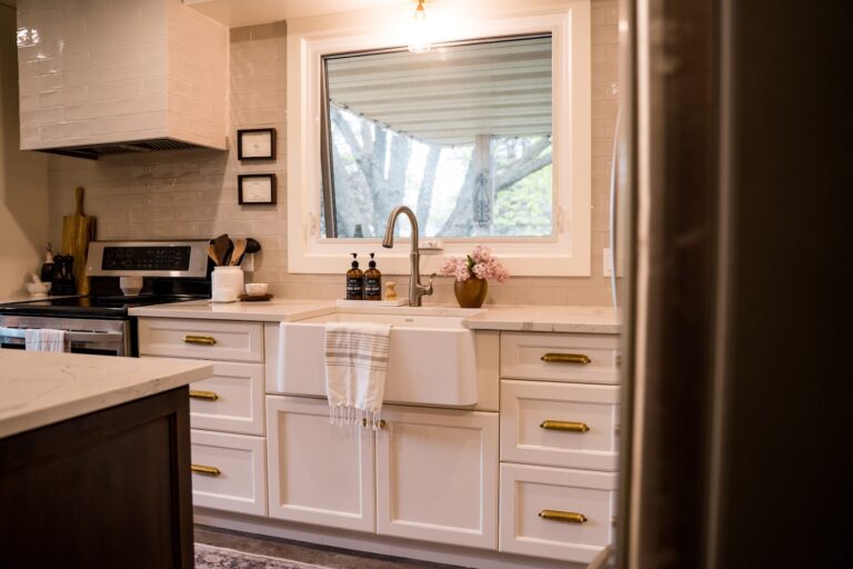 kitchen with farmhouse sink with towel hanging over edge